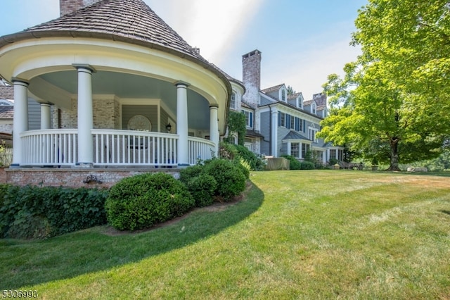 exterior space featuring a yard and covered porch