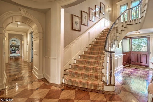 foyer entrance featuring ornamental molding