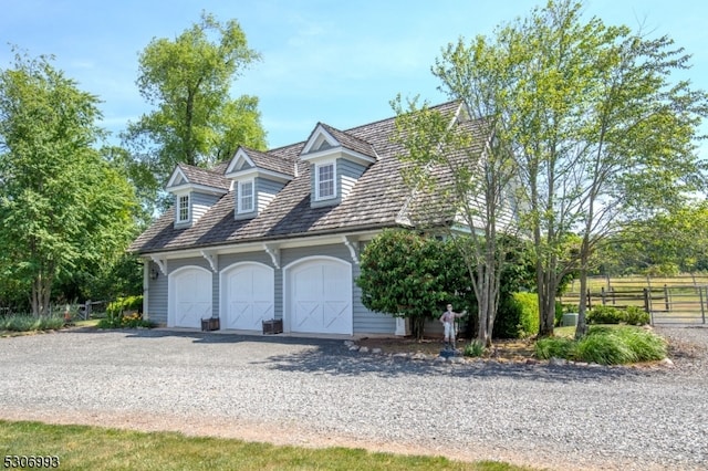 cape cod house with a garage