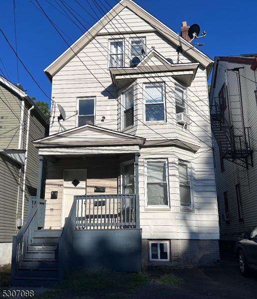 front of property featuring covered porch