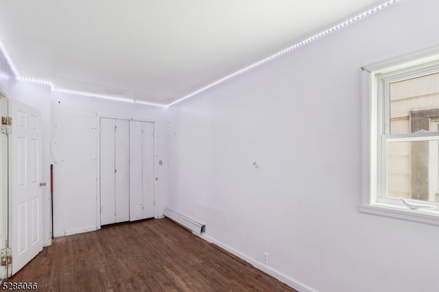 unfurnished bedroom with hardwood / wood-style floors and a closet