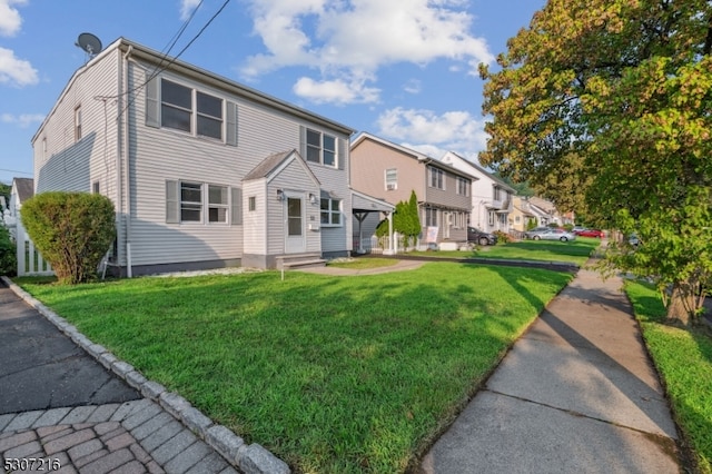 view of front of home with a front yard