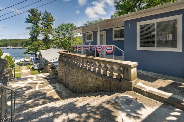 exterior space with a water view