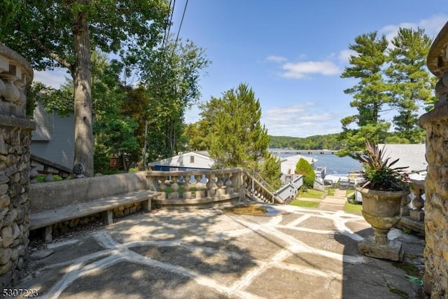 view of patio featuring a water view