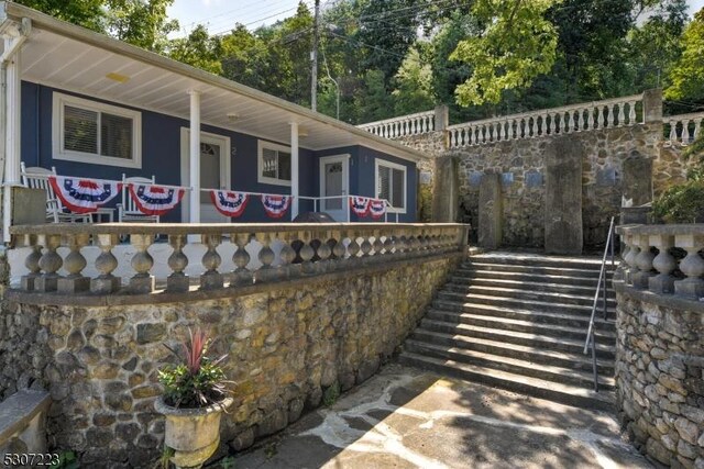 view of home's exterior featuring covered porch