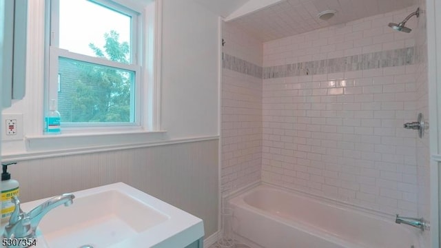 16 New St, Montclair Twp, NJ 07042 - bathroom featuring a wainscoted wall, vanity, and shower / bath combination