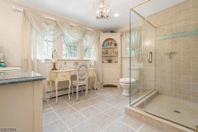 bathroom with a shower with shower door, toilet, tile patterned floors, baseboard heating, and vanity