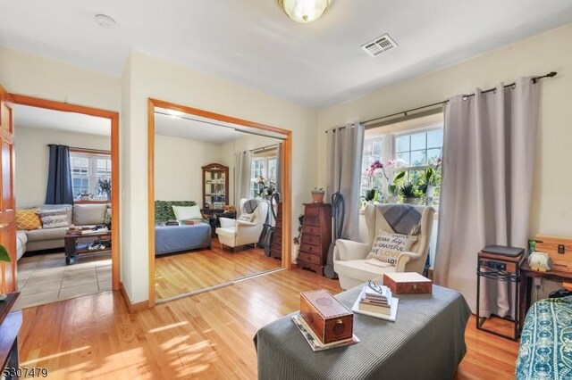 living room with light hardwood / wood-style flooring