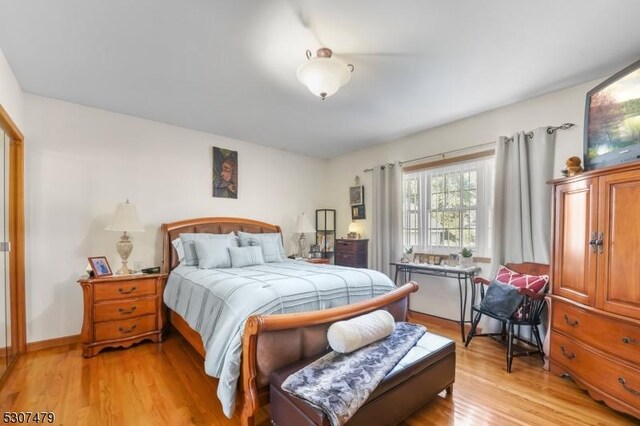 bedroom with light hardwood / wood-style floors