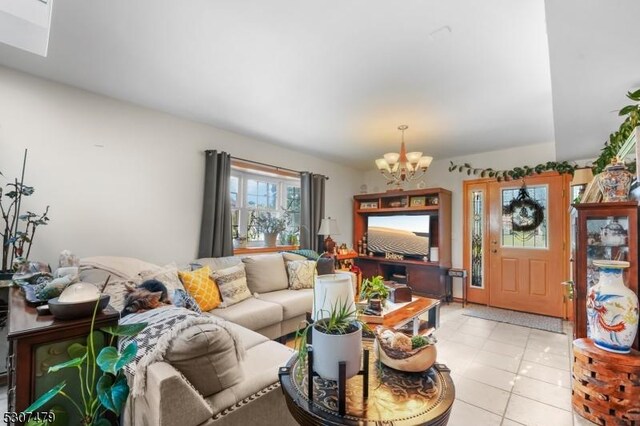 tiled living room with a chandelier