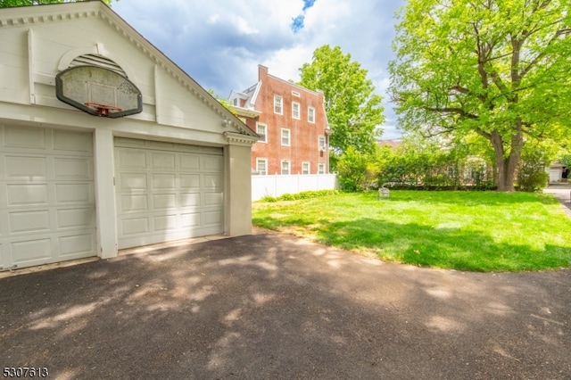 garage featuring a lawn