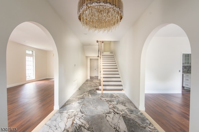 interior space with an inviting chandelier and hardwood / wood-style floors