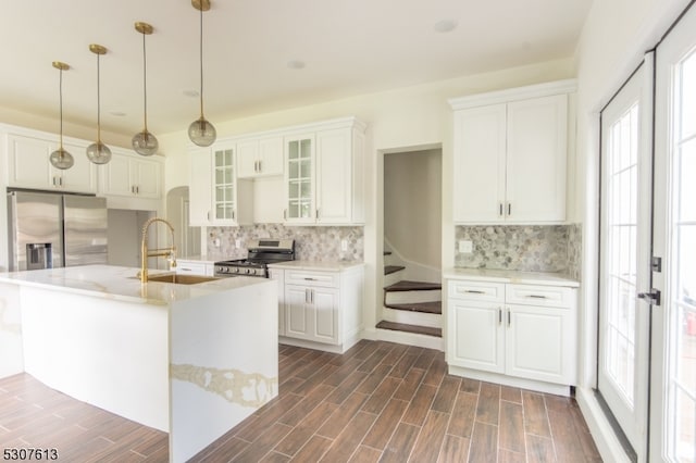 kitchen featuring white cabinets, stainless steel appliances, sink, and dark hardwood / wood-style flooring