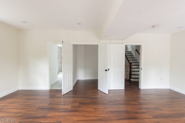 empty room featuring dark wood-type flooring