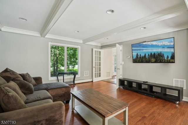 living room featuring beam ceiling, ornamental molding, and hardwood / wood-style flooring