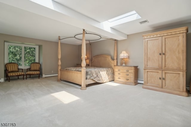 carpeted bedroom featuring a skylight and baseboard heating