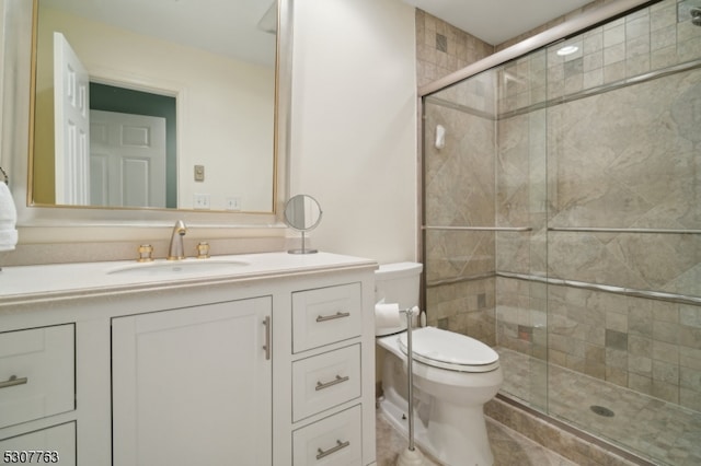 bathroom with toilet, vanity, walk in shower, and tile patterned floors