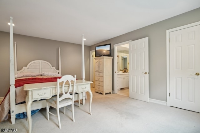 carpeted bedroom featuring ensuite bathroom