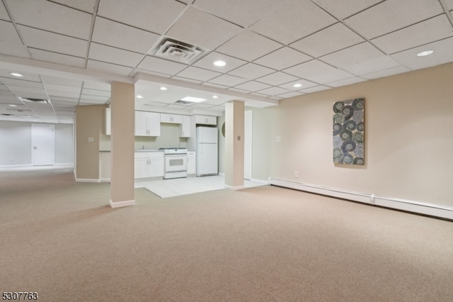 unfurnished living room featuring a baseboard radiator, a drop ceiling, and light colored carpet