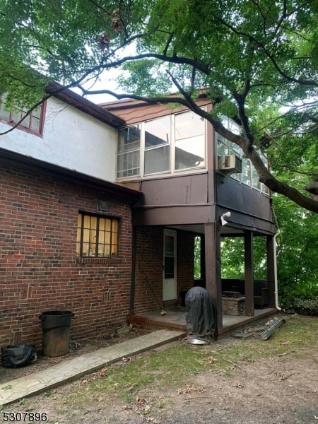 back of house with cooling unit