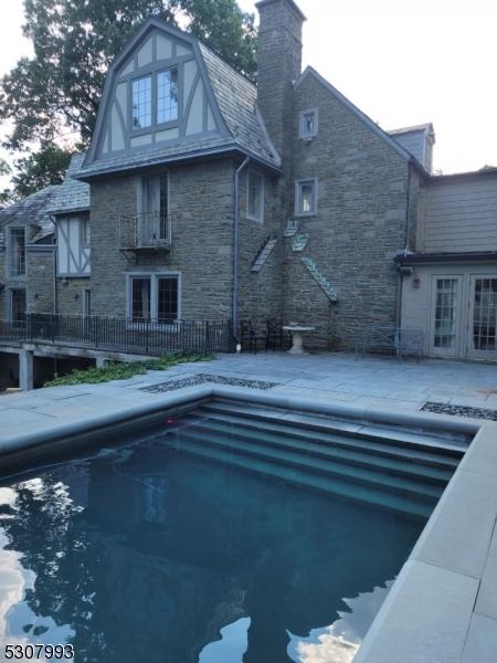 view of swimming pool featuring a patio area and a fenced in pool