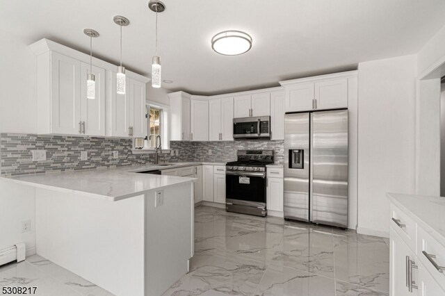 kitchen with backsplash, decorative light fixtures, kitchen peninsula, appliances with stainless steel finishes, and white cabinets