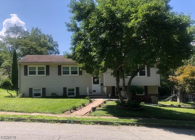 bi-level home with a front lawn