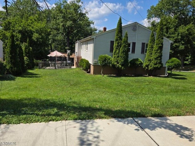 view of home's exterior with a lawn