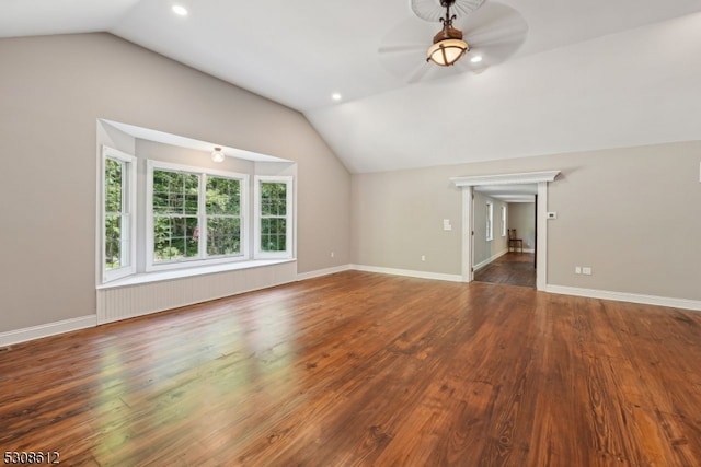 interior space featuring dark wood-type flooring, ceiling fan, and lofted ceiling