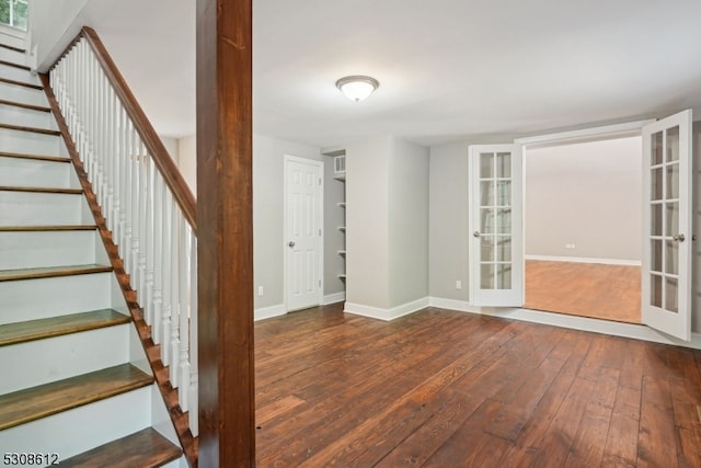 interior space with dark hardwood / wood-style flooring and french doors