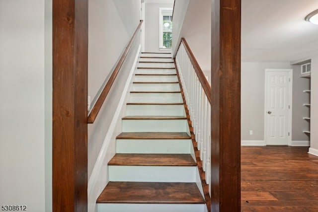 stairs with wood-type flooring