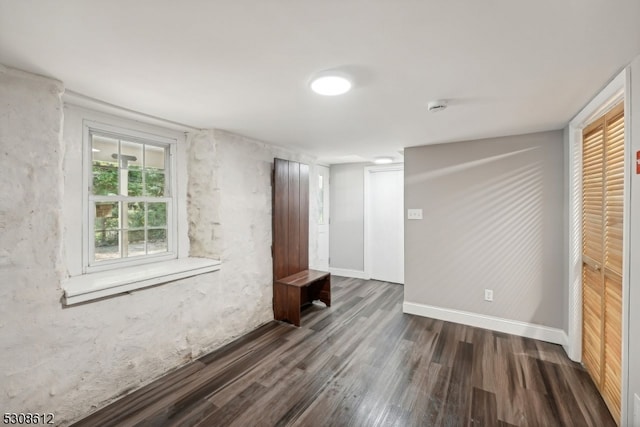 unfurnished room with dark hardwood / wood-style floors