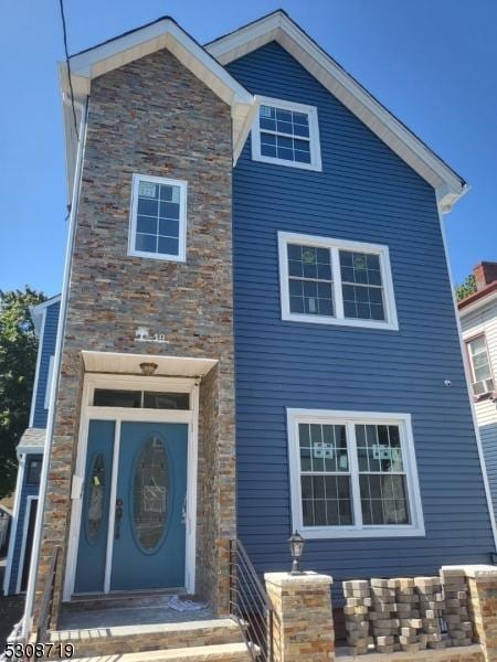 view of front of home with stone siding