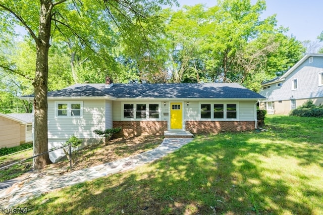 ranch-style home featuring a front yard