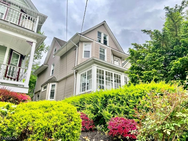 view of home's exterior with a balcony