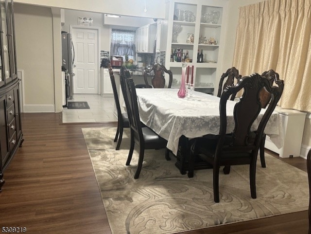 dining room featuring wood-type flooring