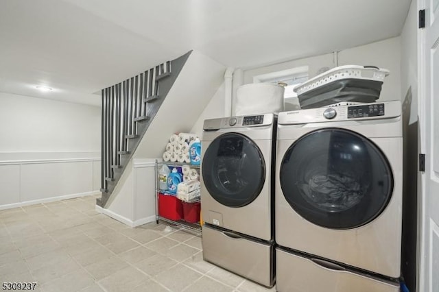 laundry room featuring laundry area and washing machine and dryer