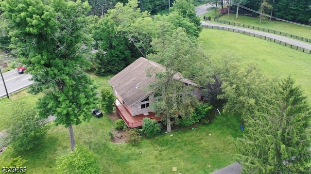 birds eye view of property with a rural view