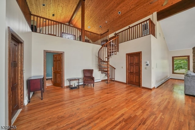 foyer entrance with wooden ceiling, high vaulted ceiling, and hardwood / wood-style flooring