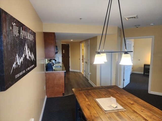 kitchen featuring dark hardwood / wood-style floors and butcher block counters