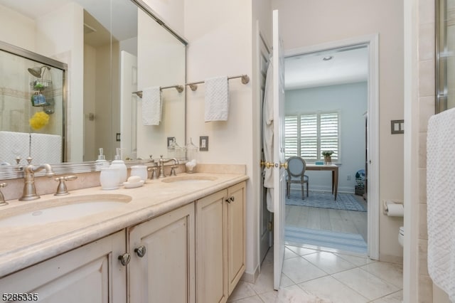 bathroom featuring vanity, toilet, tile patterned floors, and walk in shower