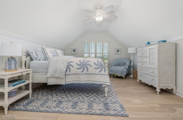 bedroom featuring lofted ceiling, hardwood / wood-style flooring, and ceiling fan