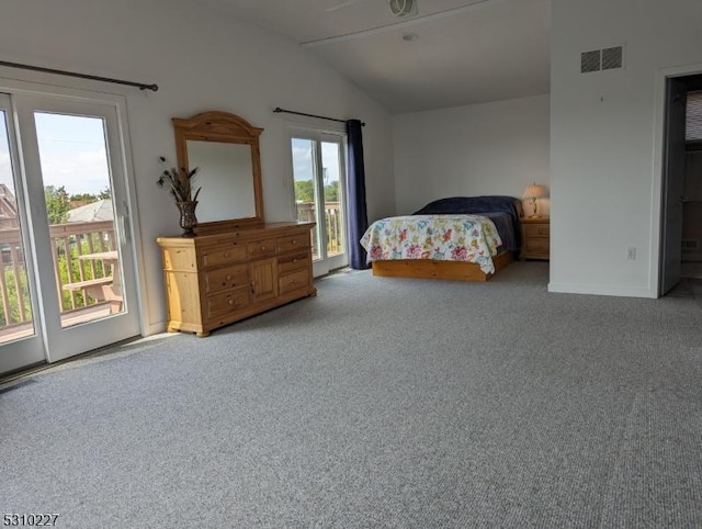 bedroom featuring access to exterior, carpet flooring, and lofted ceiling