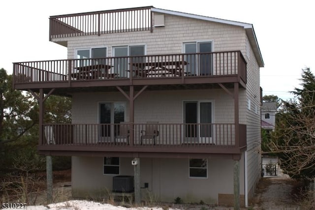 rear view of house with central AC unit