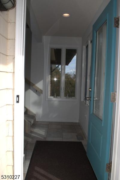 interior space featuring dark tile patterned floors