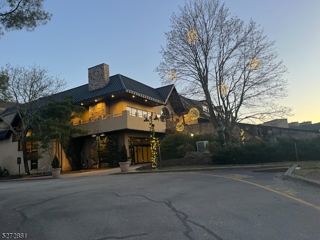 view of outdoor building at dusk