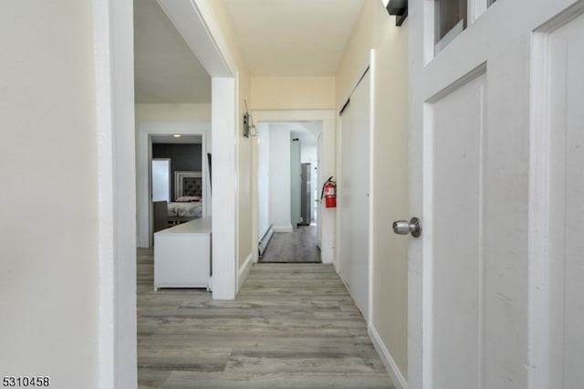 hallway featuring light hardwood / wood-style flooring