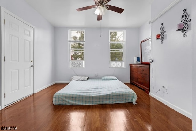 bedroom featuring ceiling fan and wood-type flooring