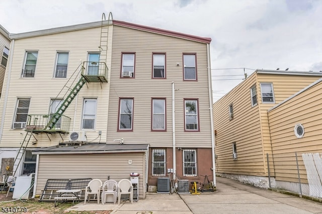 back of house with central AC and a patio area