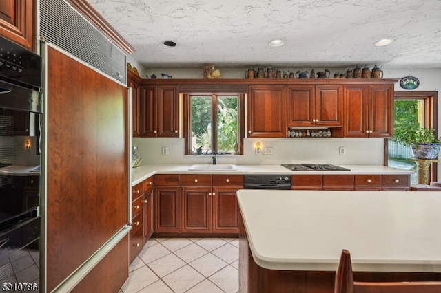 kitchen with black dishwasher, light tile patterned flooring, sink, stainless steel gas stovetop, and paneled built in fridge